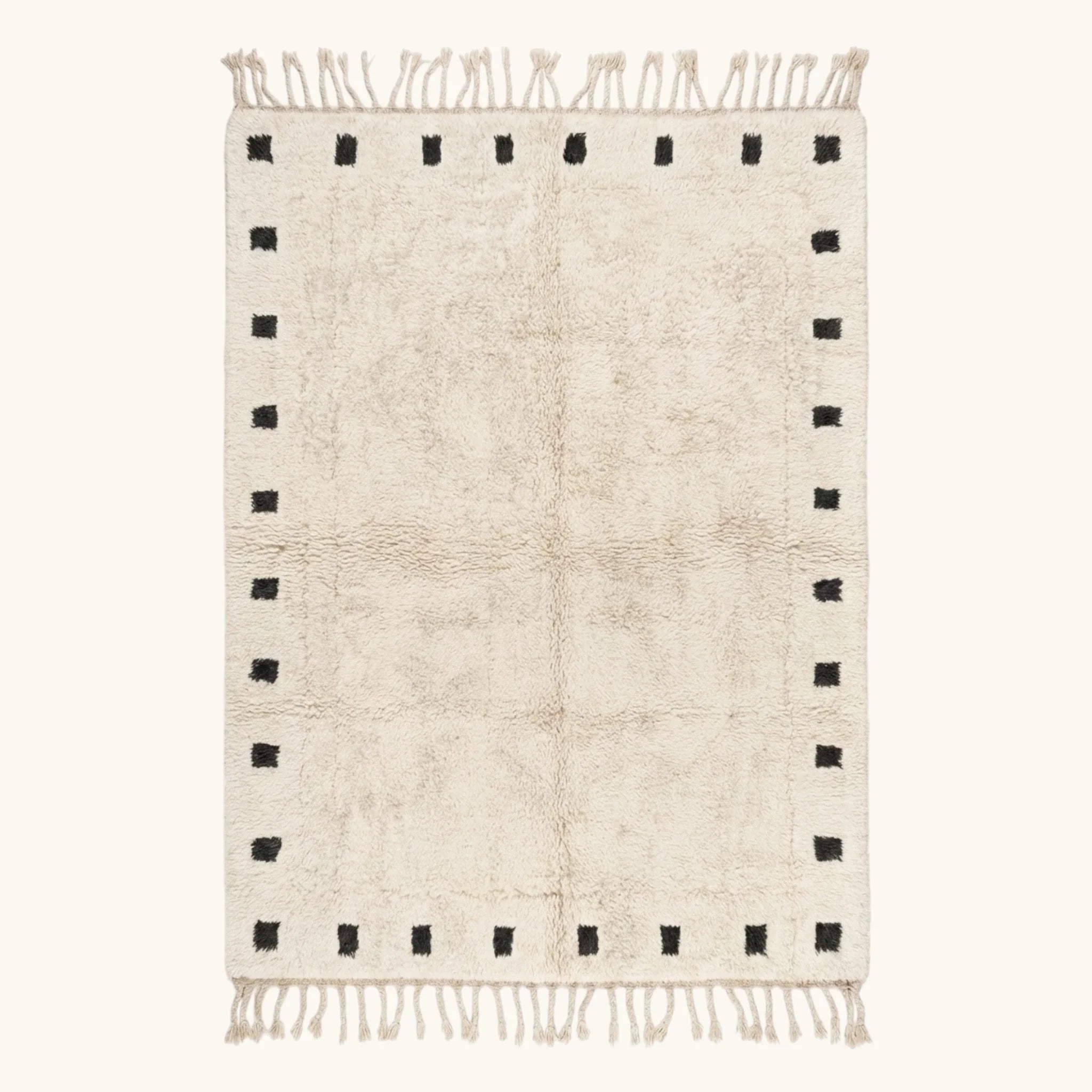 Full view of the ivory and black square border Beni Ourain rug.