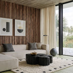 Ivory and black square border Moroccan rug styled in a living room.