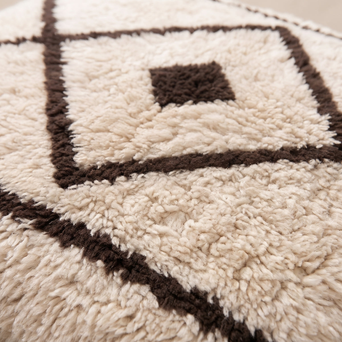 Close-up of the beni lines pattern on the Amayas Moroccan wool pillow