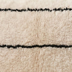 Close-up of the hairline grid pattern on the Tidi Moroccan wool pillow