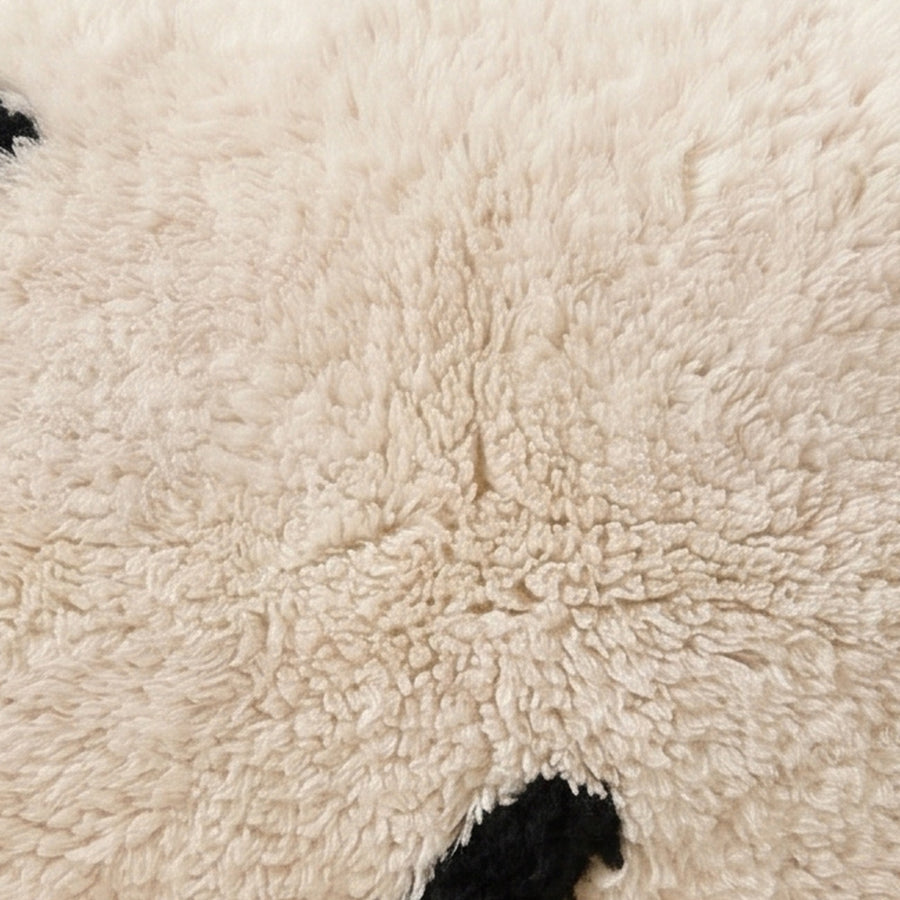 Close-up of the minimal marks pattern on the Azul Moroccan wool pillow