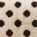 Close-up of the polka dots pattern on the Anir Moroccan wool pillow