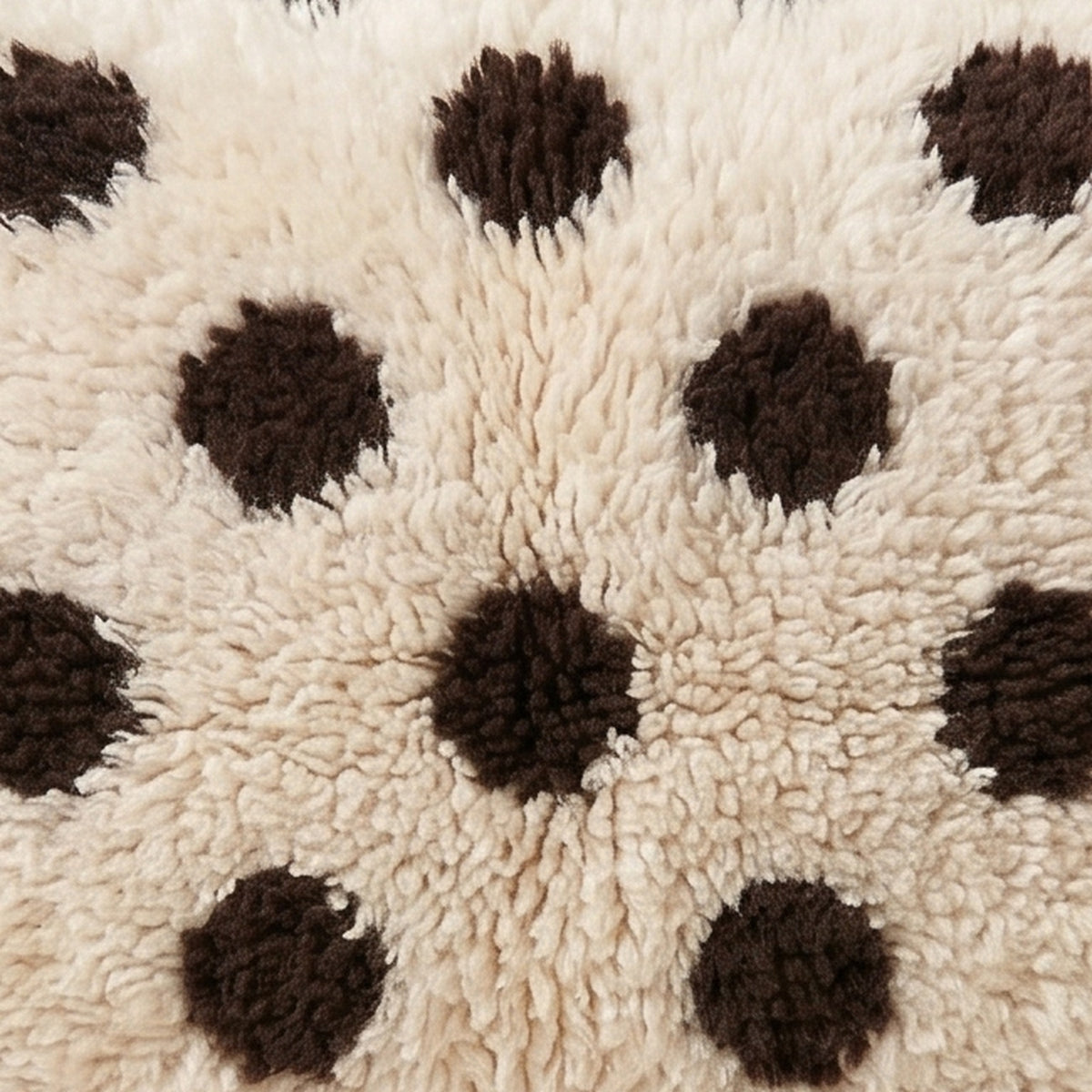 Close-up of the polka dots pattern on the Anir Moroccan wool pillow