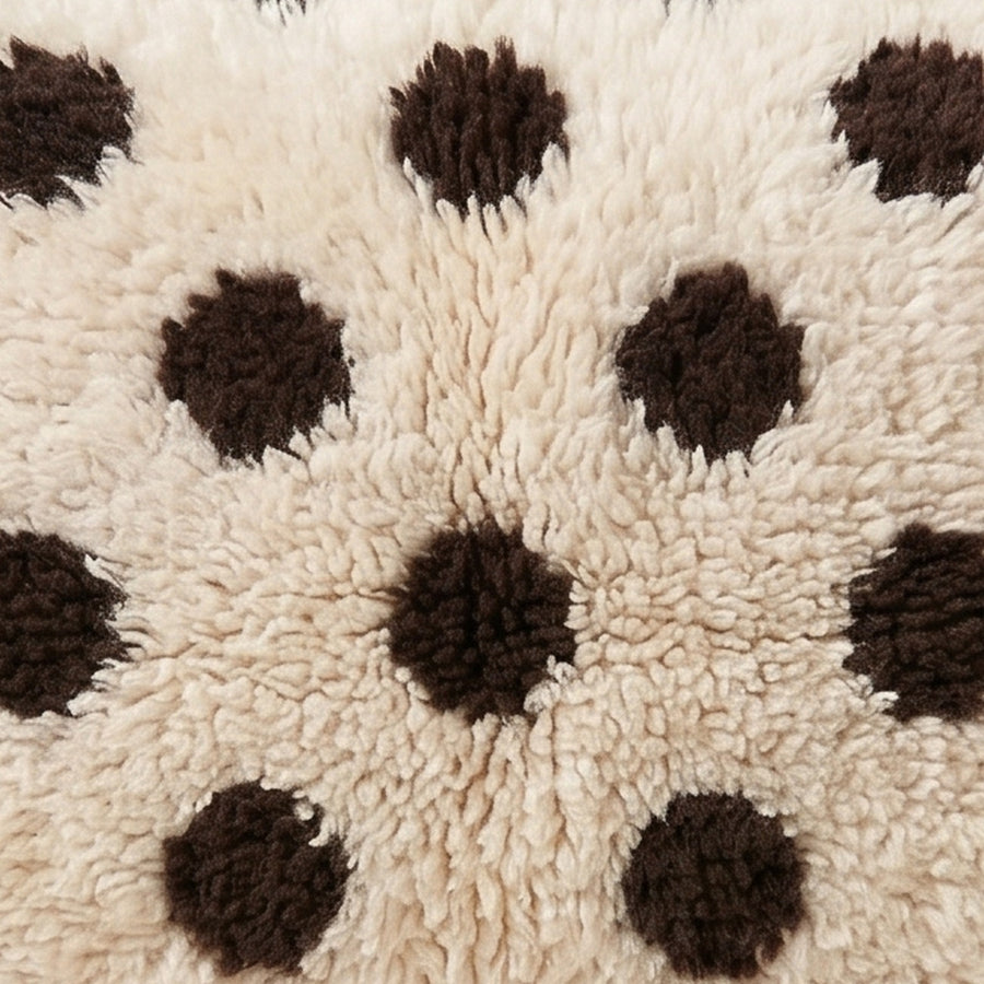 Close-up of the polka dots pattern on the Anir Moroccan wool pillow