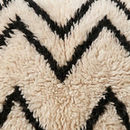 Close-up of the water lines pattern on the Aman Moroccan wool pillow