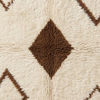 Close texture showing brown diamond center and soft ivory wool surrounding