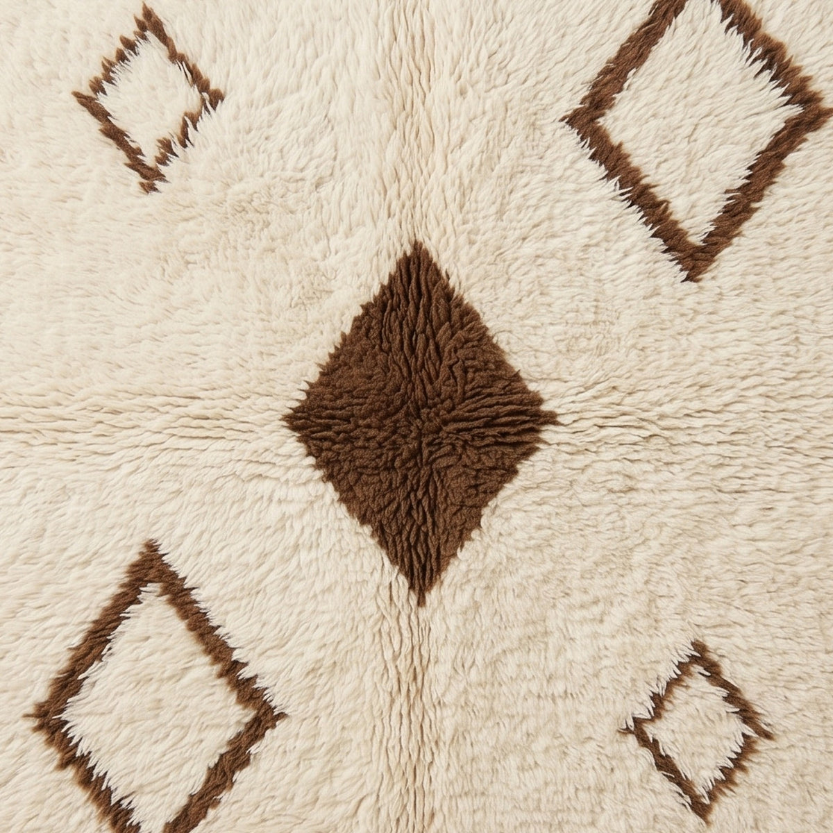 Detail of hollow diamond outline and central filled diamond on soft ivory pile