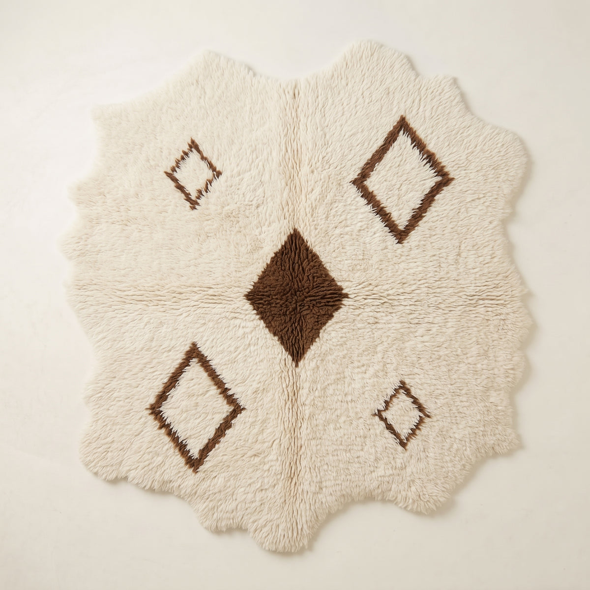 Ivory Beni Ourain rug with brown diamond lattice, full flat view showing irregular organic edges