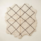 Ivory Beni Ourain rug Ifri with brown open lattice diamond design, flat lay on white background