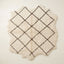 Ivory Beni Ourain rug Ifri with brown open lattice diamond design, flat lay on white background