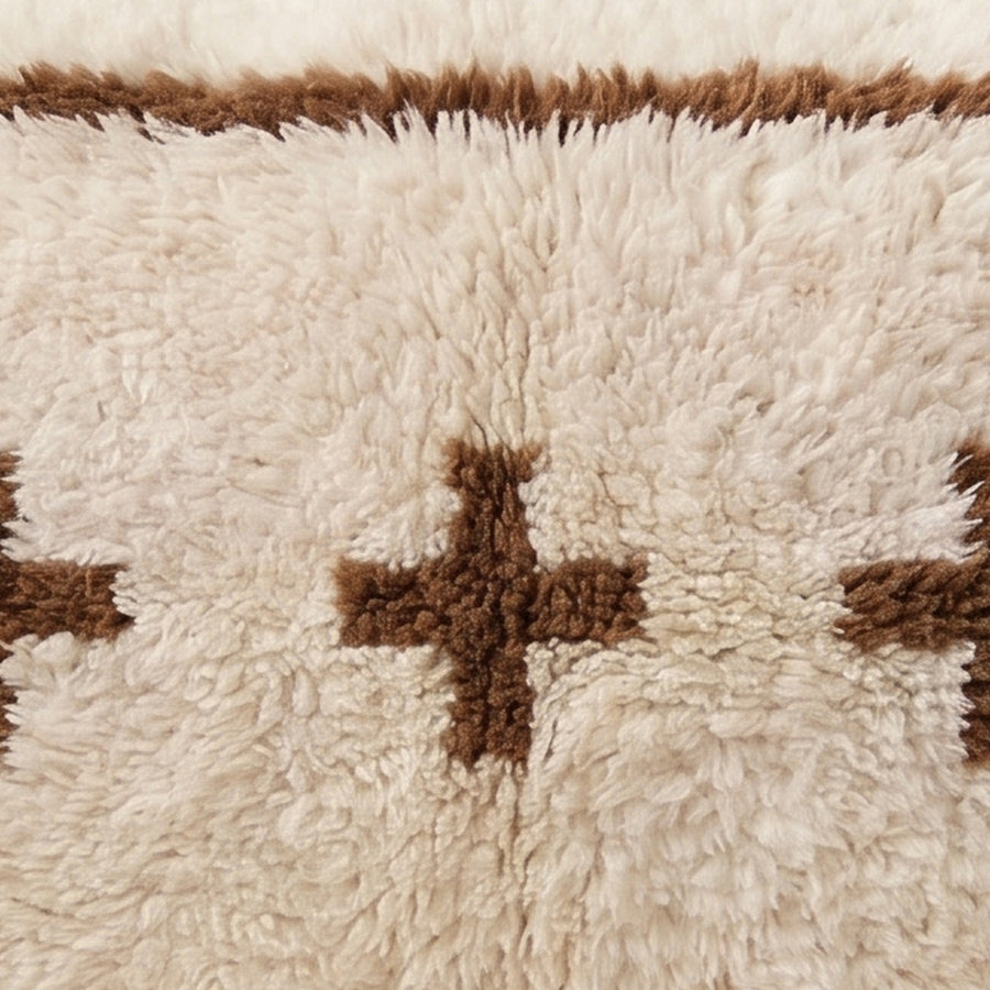 Close-up of the berber crosses pattern on the Tamazgha Moroccan wool pillow
