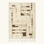 Full view of the Tinmel ivory, brown and olive Beni Ourain rug with an abstract linear design.