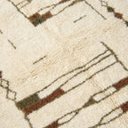 Craftsmanship detail of the Tinmel ivory, brown and olive hand-knotted rug.