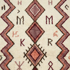 Natural wool texture and burgundy motif detail on the Akalas Azilal rug