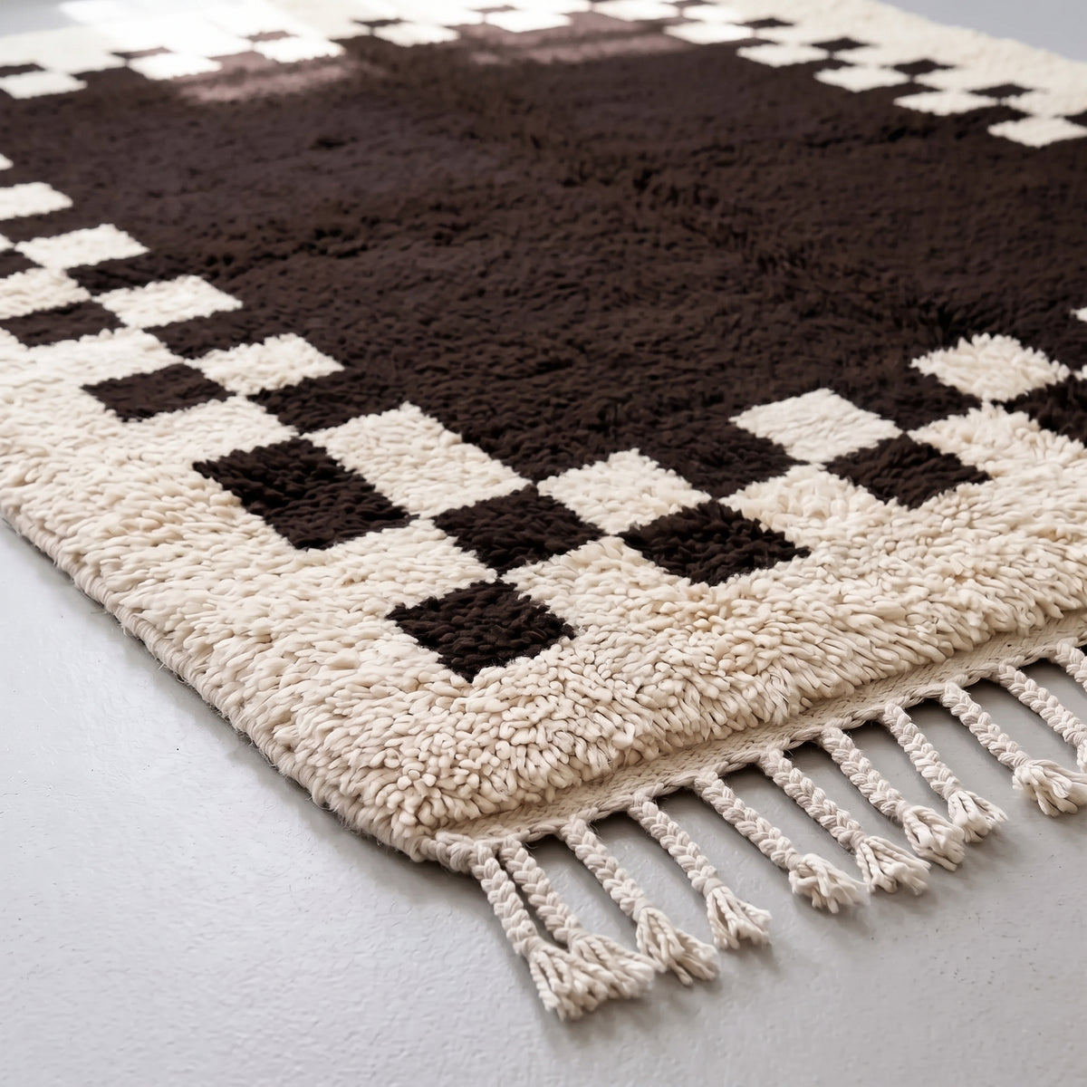 Angled pile detail showing thick soft texture and checkerboard geometry