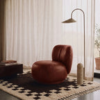 Ivory and charcoal Beni Ourain checkerboard rug in living room with burgundy chair