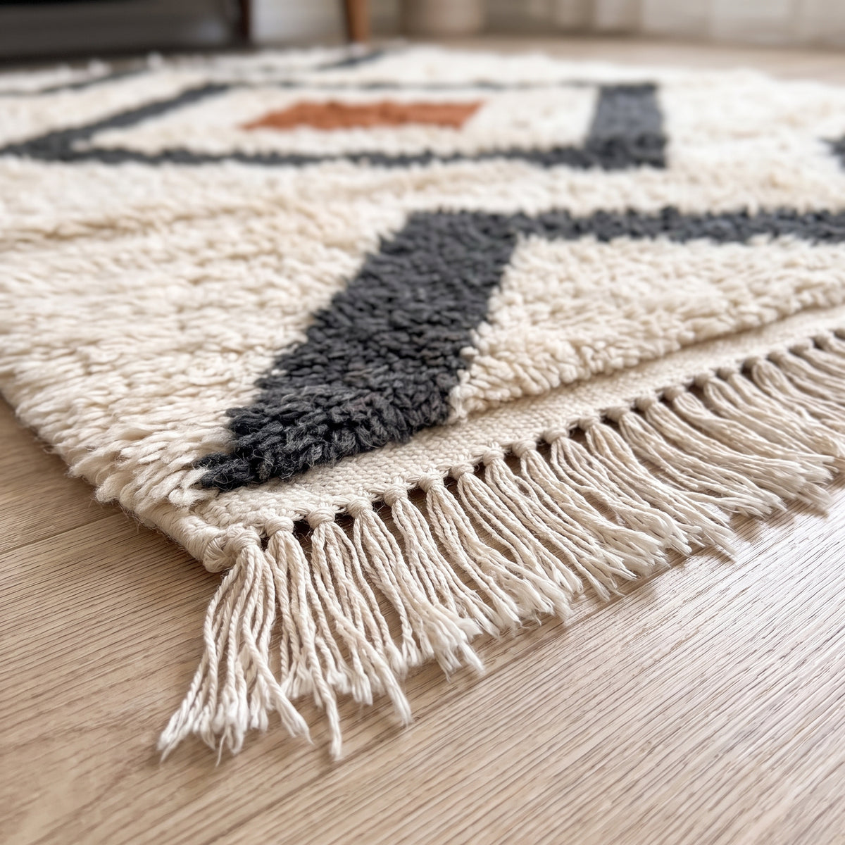 Side view of Beni Ourain rug showing layered diamond design and thick wool pile construction