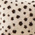 Side view of the Tazzla Moroccan pillow showing its ivory and cocoa wool pile