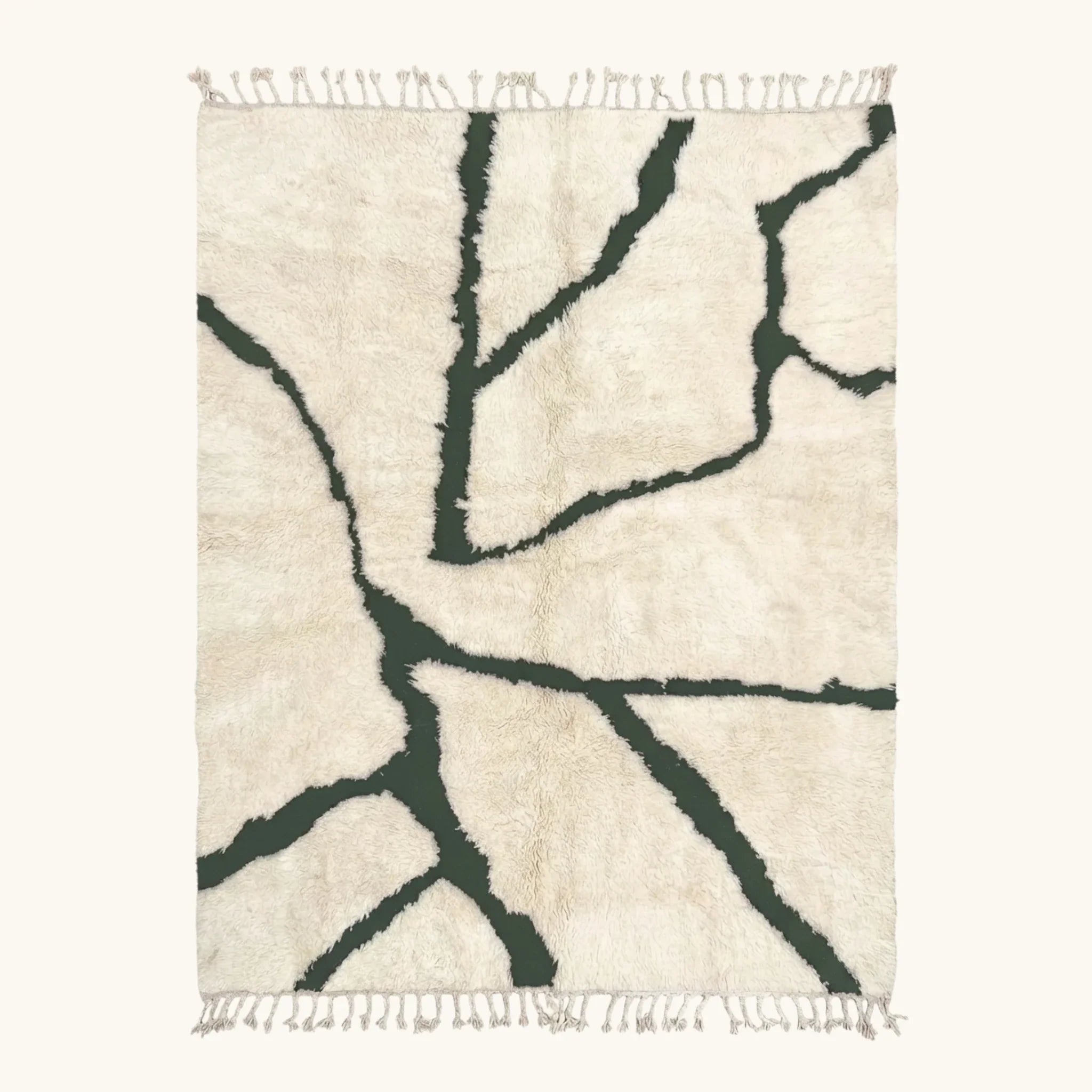 Full view of the Tazla ivory and forest green Beni Ourain rug with a branch line design.