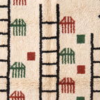 Close-up of rug edge and fringe showing ladder and comb motif detail with ivory fringe trim