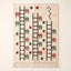 Ivory Beni Ourain rug with black ladder and zigzag motif, terracotta and forest green comb shapes scattered throughout, Ayyur design