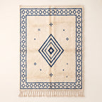 Ivory & Indigo Beni Ourain Rug with concentric diamond design and scattered motifs, flat view