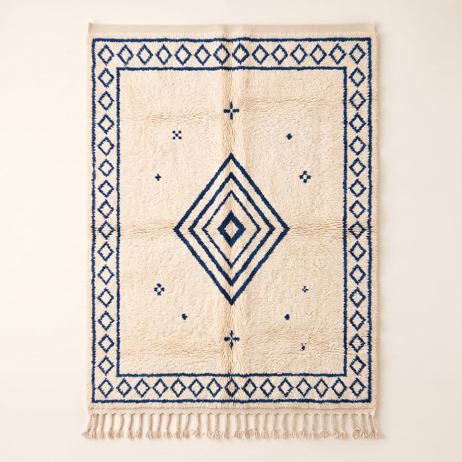 Ivory & Indigo Beni Ourain Rug with concentric diamond design and scattered motifs, flat view