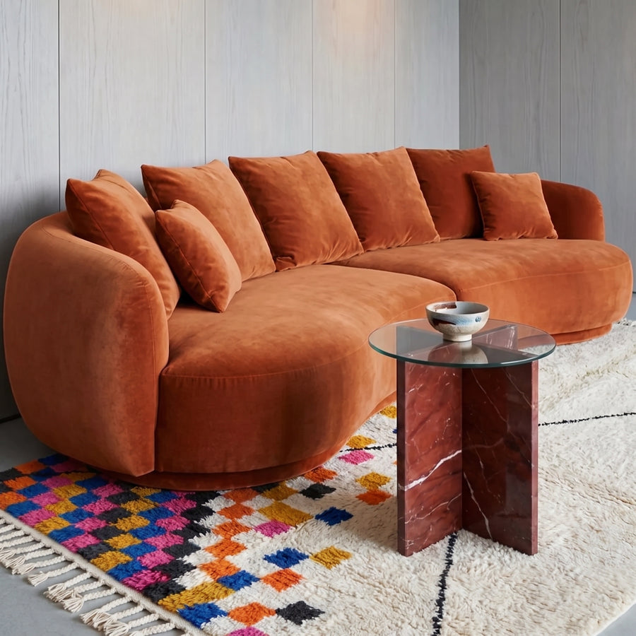 Checker drift Azilal rug in modern living room under burnt orange curved sofa