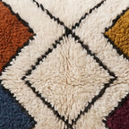 Close-up of the open lattice pattern on the Taziri Moroccan wool pillow