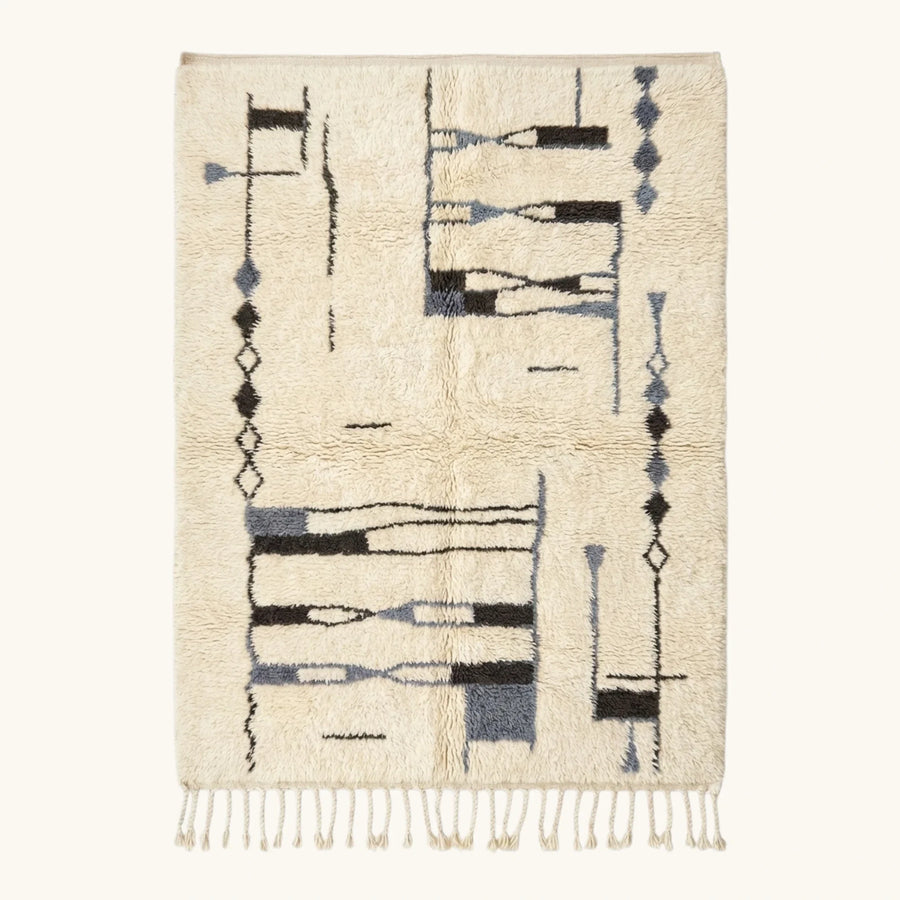 Full view of the Amun ivory, navy and black Beni Ourain rug with an abstract linear design.