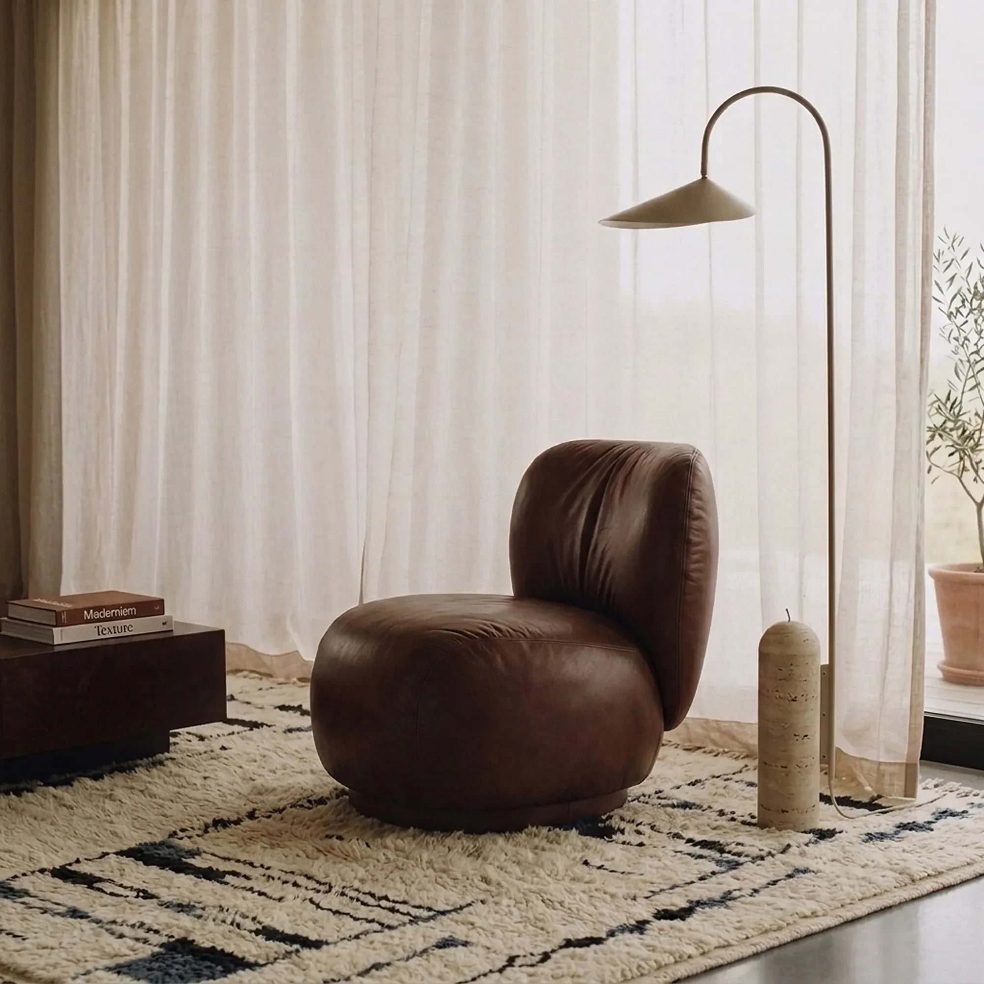 Amun ivory, navy and black Beni Ourain rug styled in a refined living room.