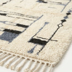 Border detail of the Amun abstract linear rug.