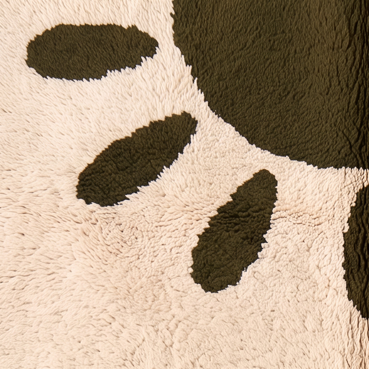 Corner detail showing olive oval shapes and fringe edge