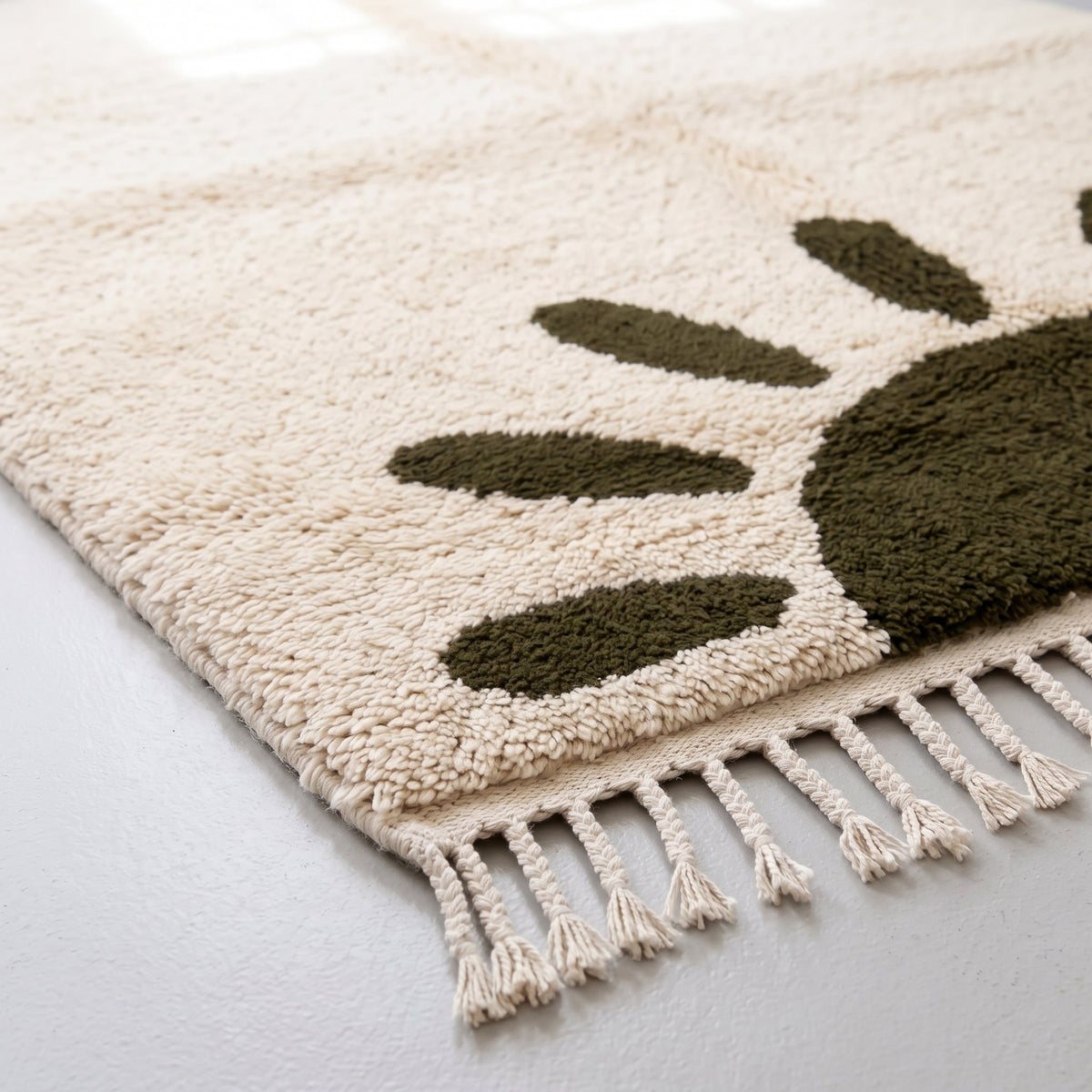 Detailed view of sun motif ovals and soft wool pile construction