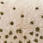 Close-up of the dot drift pattern on the Tizi Moroccan wool pillow