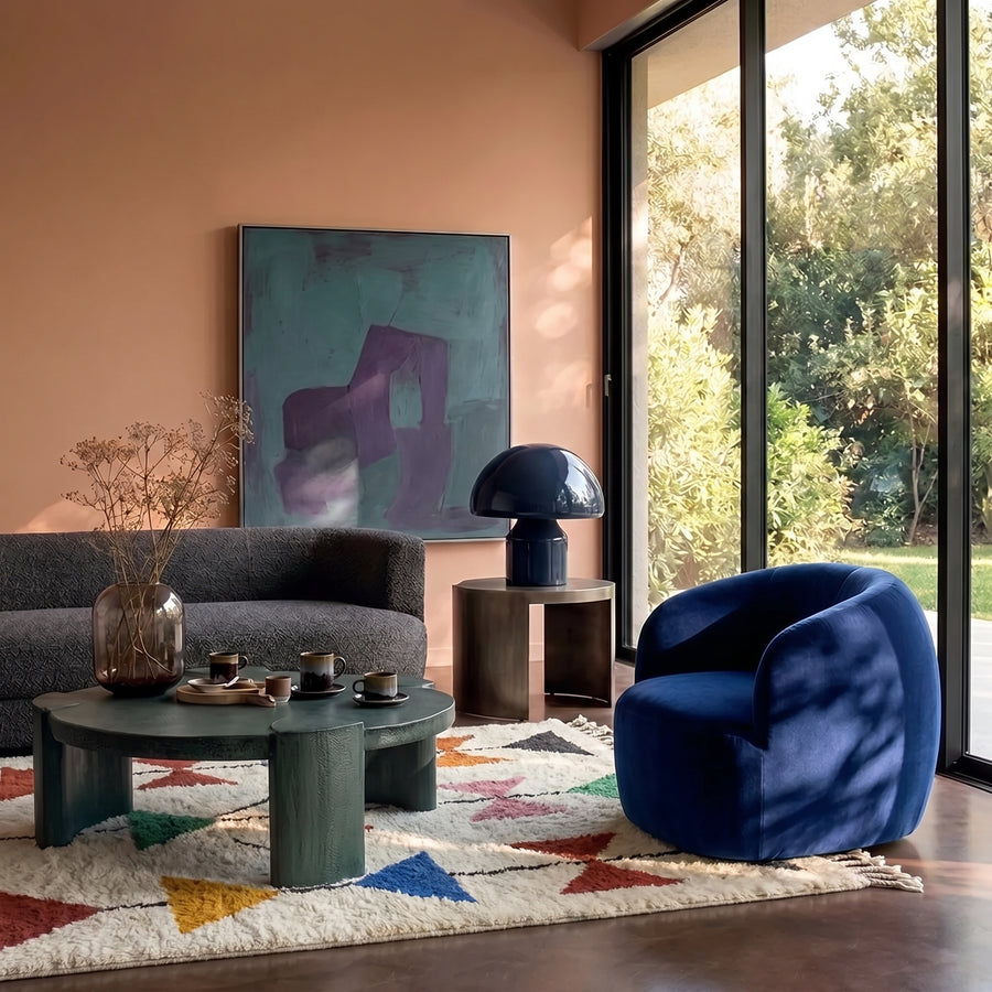 Ivory Azilal Triangle Garden rug in living room with grey sofa, blue chair and green table