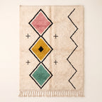 Ivory Beni Ourain rug with vertical broken diamond design in rose, gold and teal with black outlines and cream cross accents