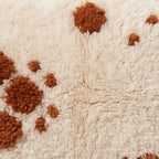Close-up of the two size dots pattern on the Tamellalt Moroccan wool pillow