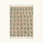 Full view of the Taddart ivory and sage green Beni Ourain rug with an oval grid design.
