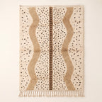 Ivory and tan Beni Ourain rug with scattered black diamonds and warm tan vertical panels with brown center band, flat lay on neutral background