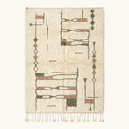 Full view of the Targa ivory, taupe and olive Beni Ourain rug with an abstract linear design.