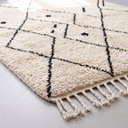Tiziri rug fringe and corner detail showing knotted fringe edge and diamond lattice structure
