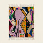 Full view of the Tamsa Boujaad rug in lilac, mustard, black, green and pink with angular abstract color-block forms