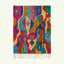 Full view of the Awrir magenta, turquoise and saffron Boujaad rug with a flowing abstract diamond design.
