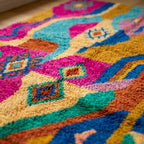 Angled view showing the pattern and wool pile of the Awrir Boujaad rug.