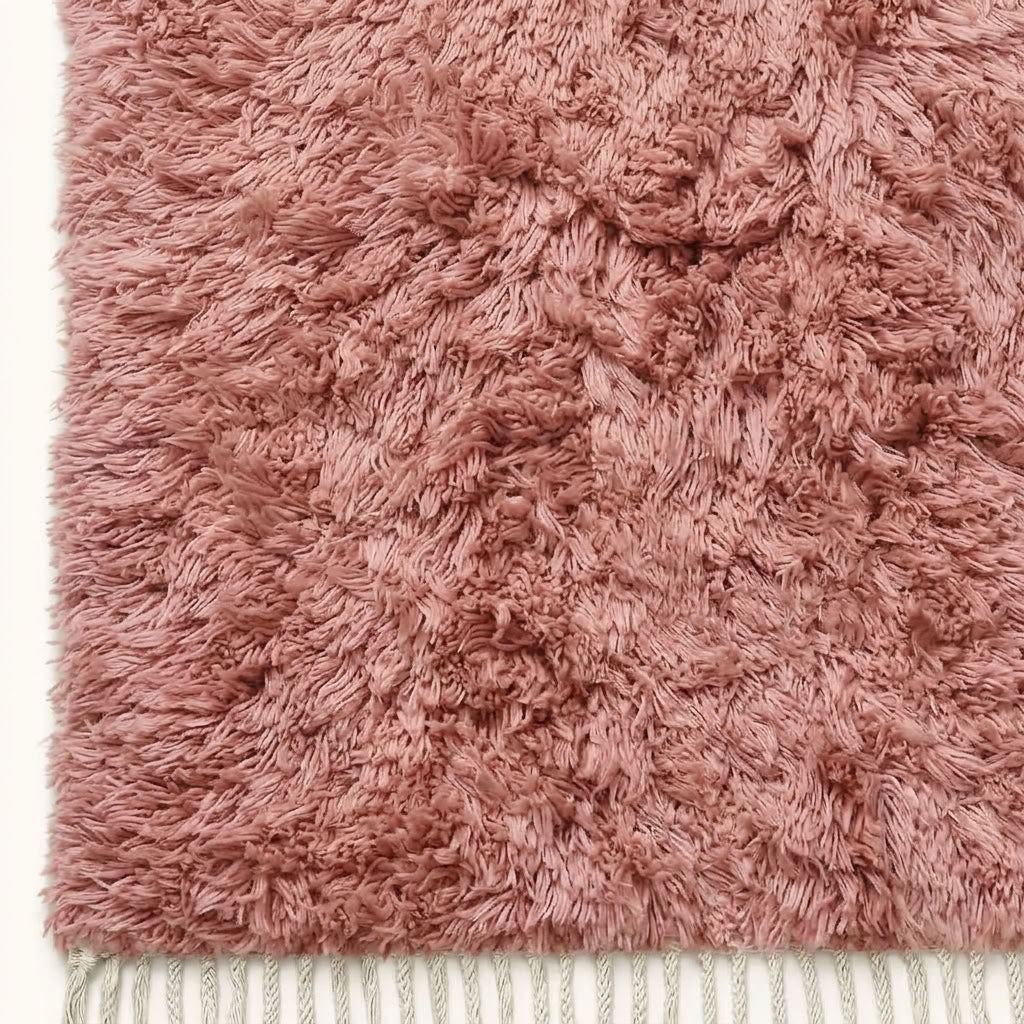 Mauve Beni Ourain rug edge detail with ivory fringe trim and pile texture