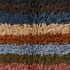 Close-up of the band stack pattern on the Tiwizi Moroccan wool pillow