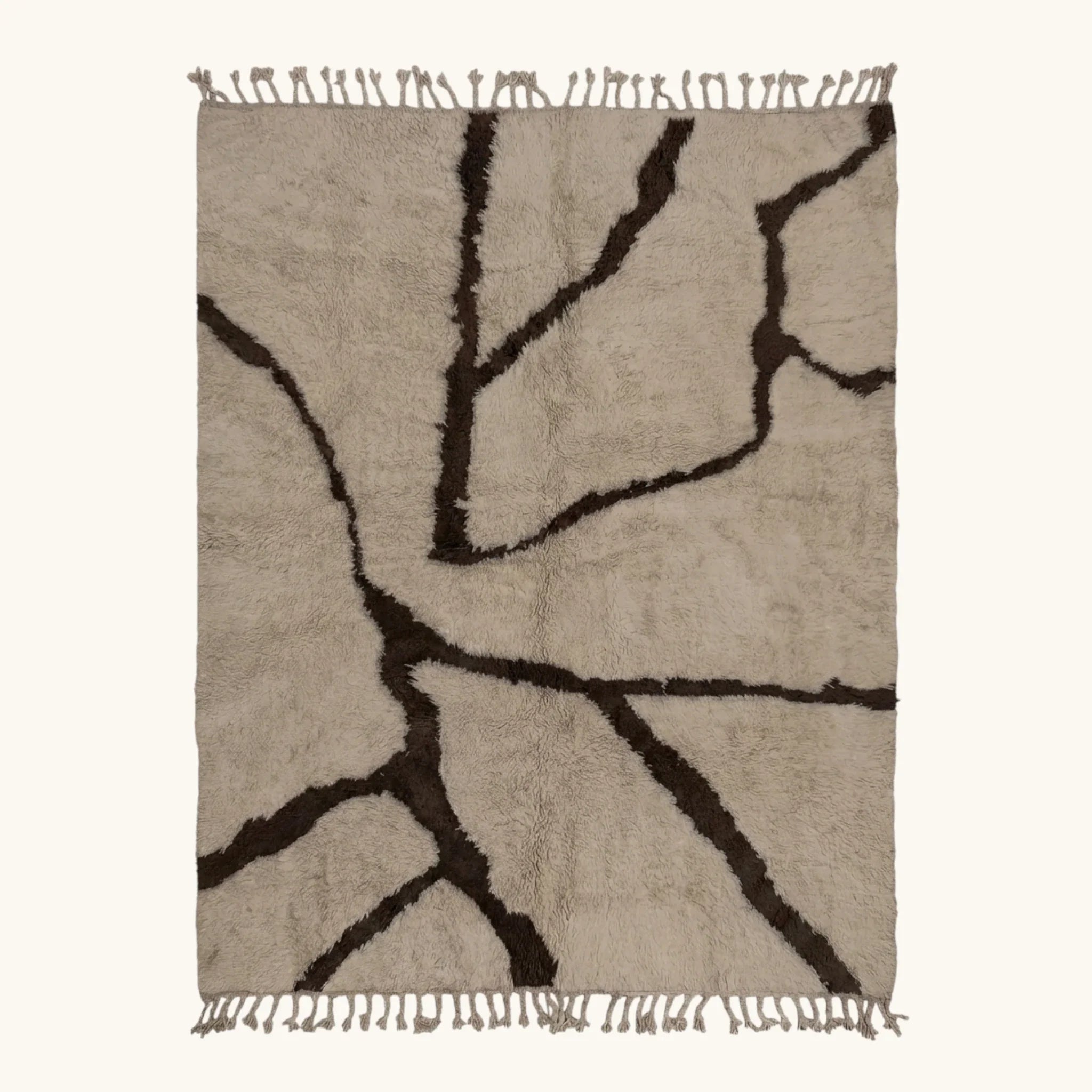 Full view of the Aylal mushroom and dark brown Beni Ourain rug with a branch line design.
