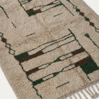 Angled view of the Tafra hand-knotted Beni Ourain rug.