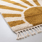 Detailed view of mustard rays and ivory stripes showing dense wool knot construction and fringe edge